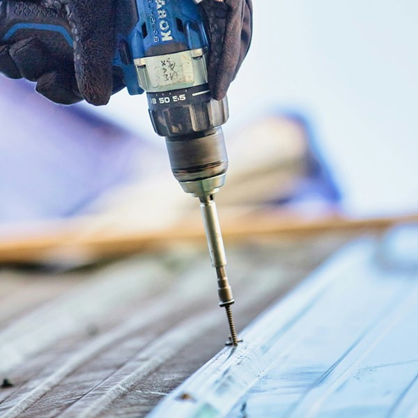 Corrosion resistant coated roofing fastener installation